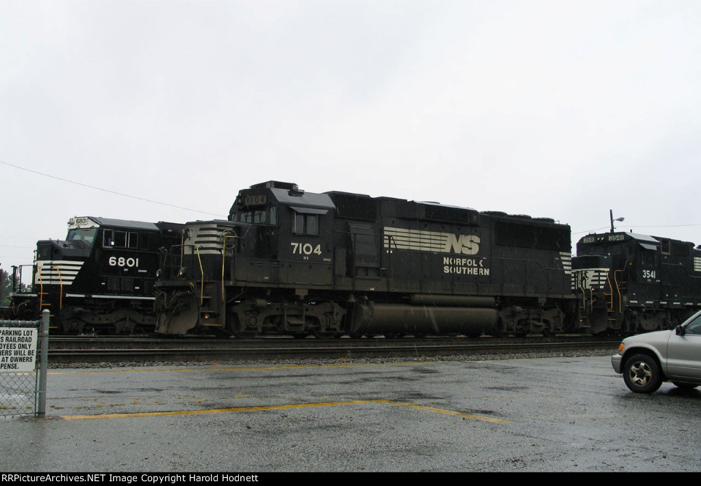 NS 7104 leads train 214 in the rain